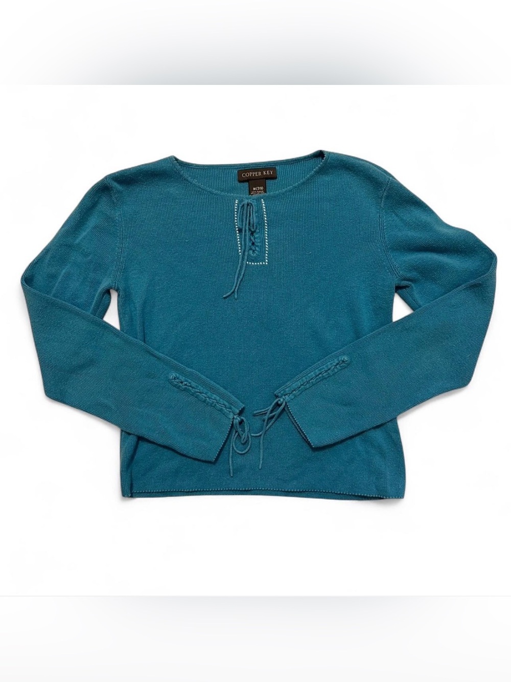 Copper Key Blue long sleeve knit top with tie details, item is in a size medium.